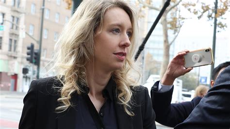 As Elizabeth Holmes heads to prison for fraud, questions remain about her motives